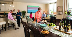 Residents enjoy a party in a spacious apartment