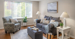 Wide angle shot of a spacious Erickson apartment home living room with modern furnishings and decorations.
